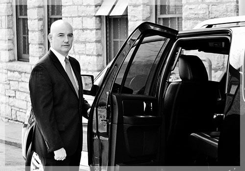 chauffeur opening limo door at long island